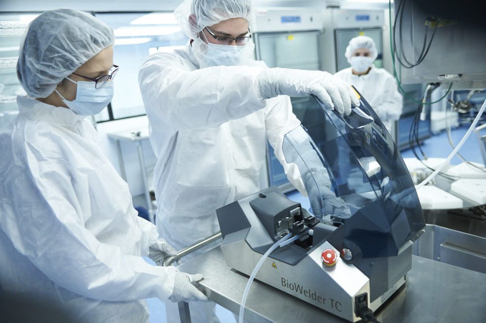 krystal biotech researchers using biowelder tc machine in laboratory