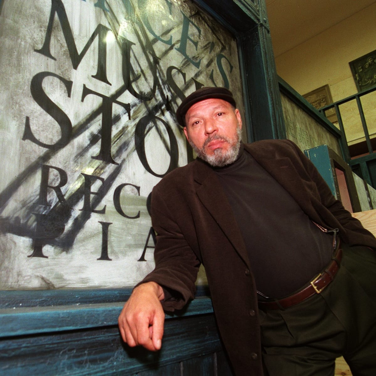 August Wilson posing in front of artwork, Barry Chin, The Boston Globe