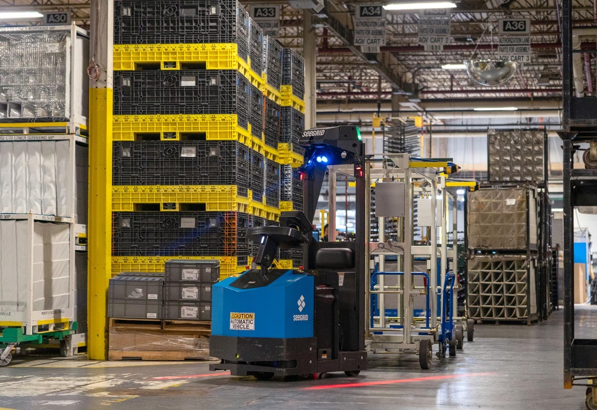 Lift moving through warehouse.