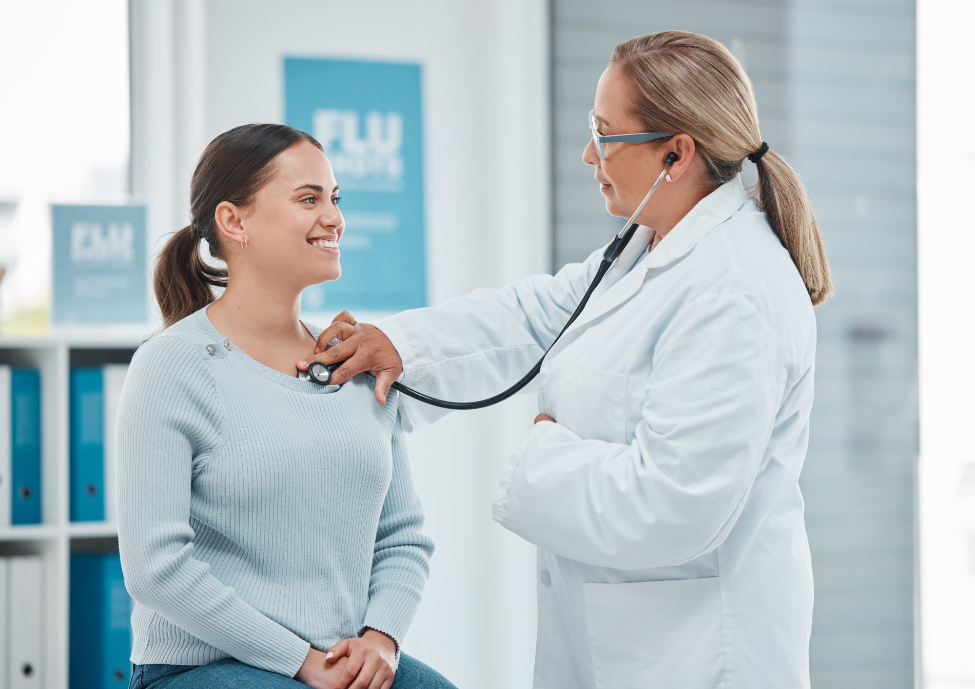 A doctor examining a patient with a stethoscope 