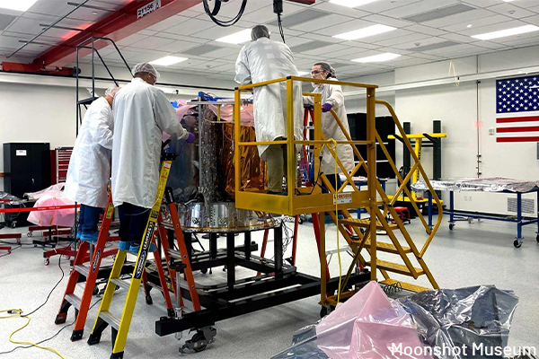 Participants in lab coats in Astrobotic’s Clean Room workshop at Pittsburgh’s Moonshot Museum.