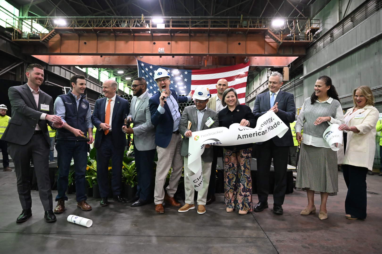 JM Steel and Nextracker executives celebrate at the new factory’s ribbon cutting.