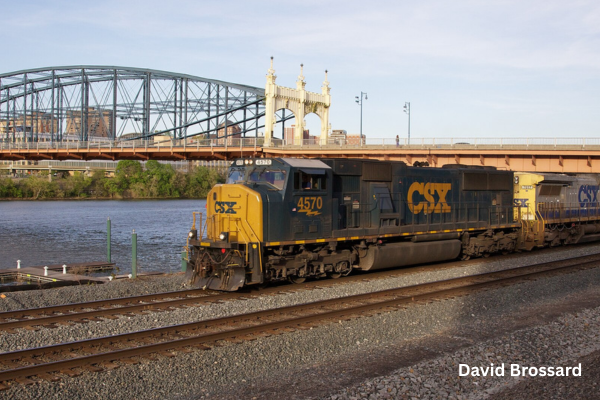Raw material transportation Attribution: By David Brossard - CSX train crossing under the Smithfield Bridge in PittsburghUploaded by GrapedApe, CC BY-SA 2.0, https://commons.wikimedia.org/w/index.php?curid=31156725