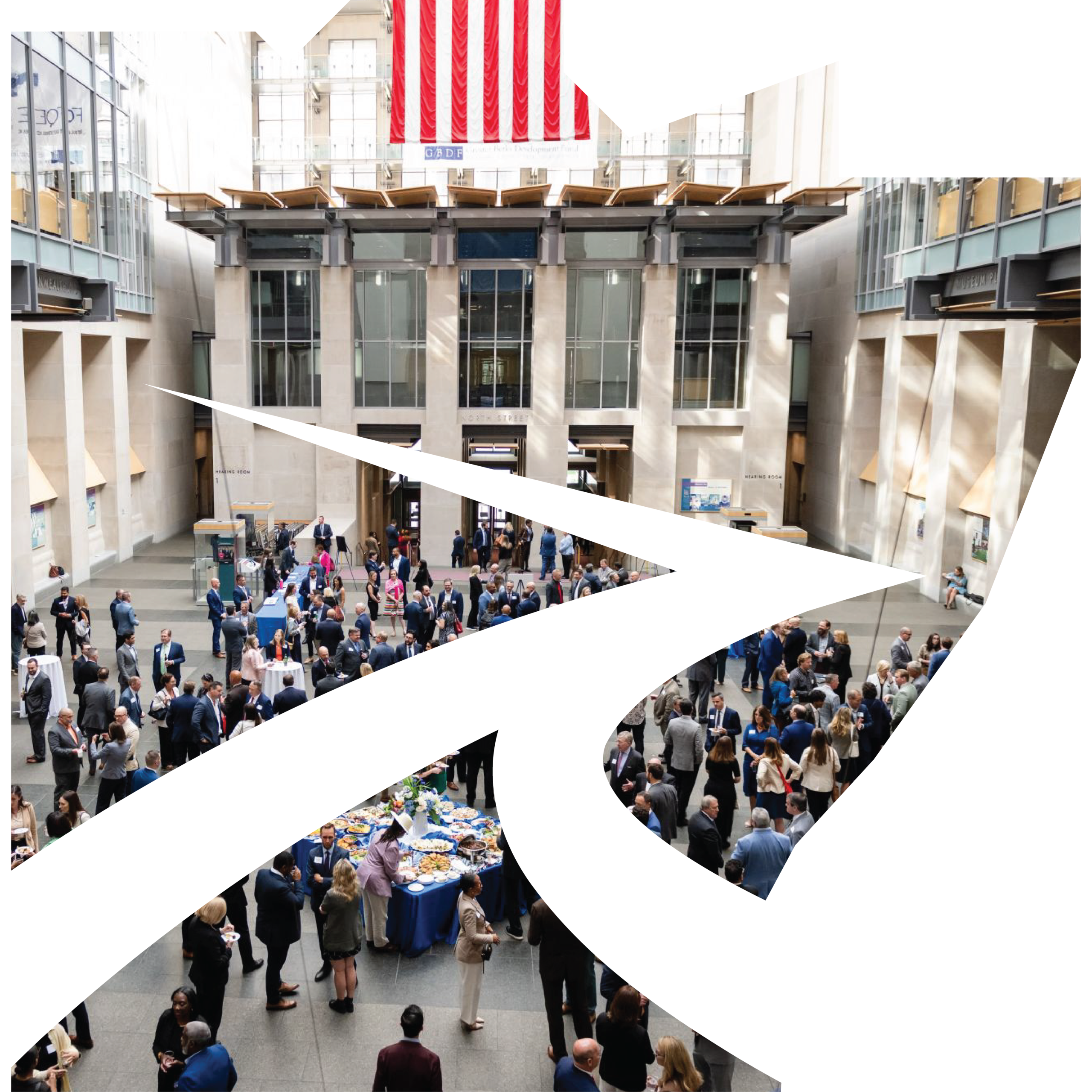 PRA logo with photo of community in civic building