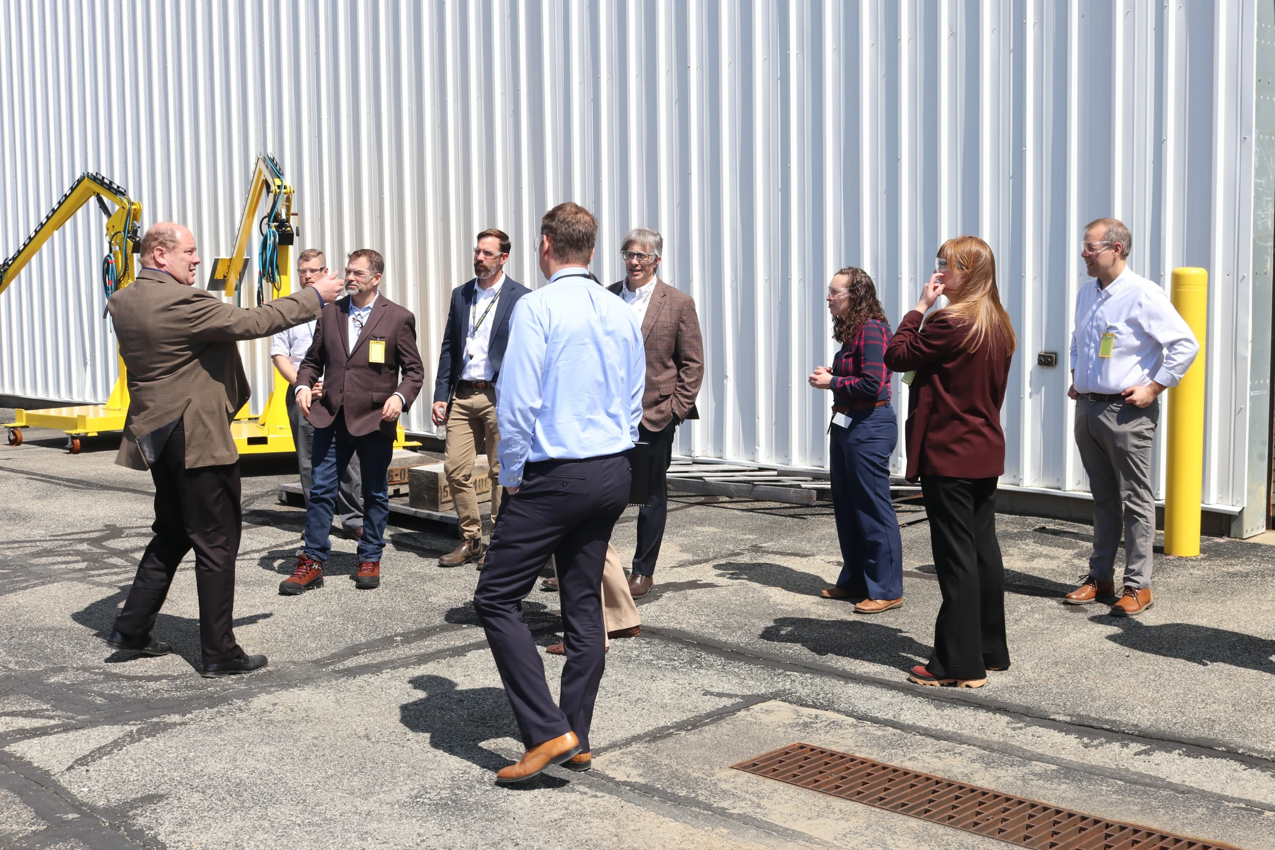 A group tours the manufacturing facility at Curtiss-Wright