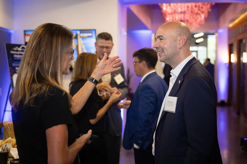 Two people conversing at a Start Up Pittsburgh event